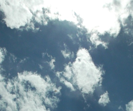 Ahura'Tua cloaked and partially behind clouds, to the left of a 'V' in the clouds, October 11, 2015.