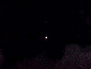 April 26, bright white ship left of Moon, Venus right, green-blue Orb above.