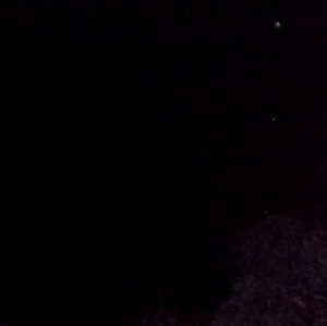 Two orbs in direct vertical alignment with Mercury, forming a line of three.