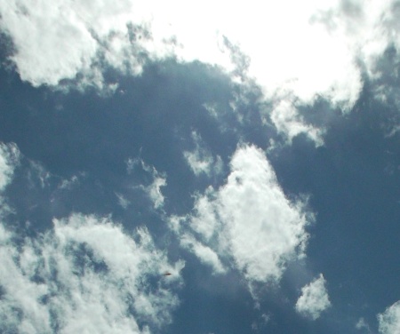 'V' shapes in upper and lower clouds, ship lower left, Oct. 11, 2015.